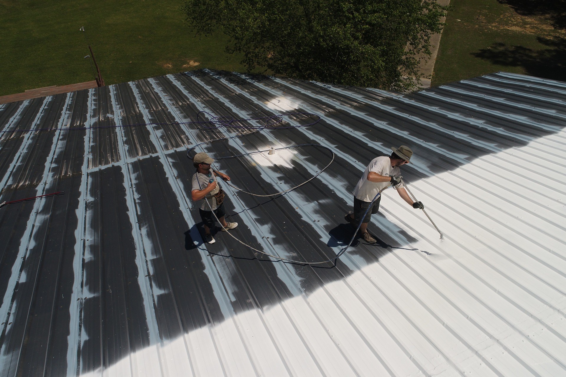 Contractors applying rubber roofing solution in Rhode Island